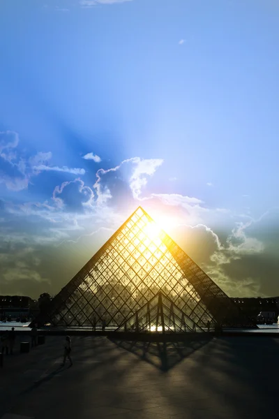 PARIS-APRIL 28 2011: Louvre pyramid at sunset