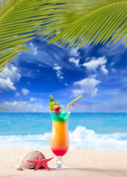 Fresh tropical cocktail on sunny beach in Maldives
