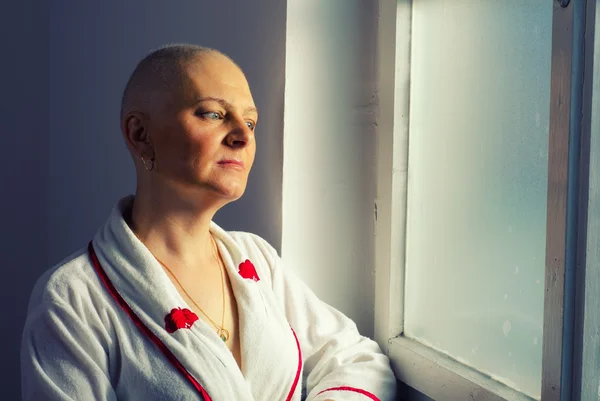 Bald woman cancer patient in the hospital