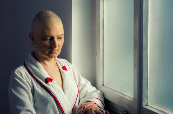 Bald woman suffering from cancer