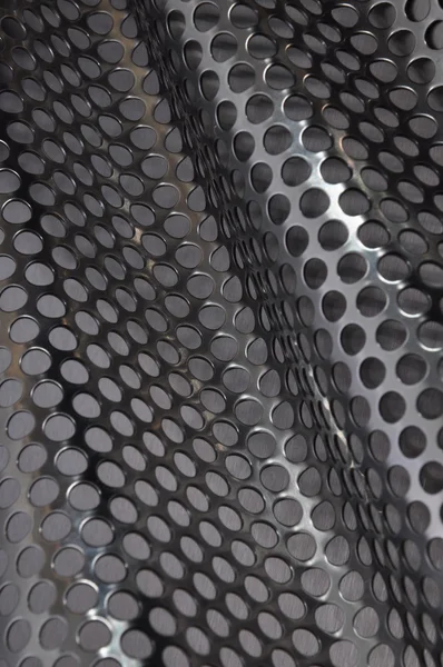 Metal sheet surface with holes