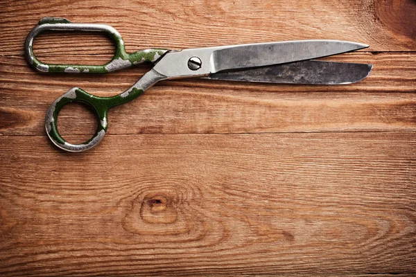 Old tailors scissors on wood background — Stock Photo #20121667
