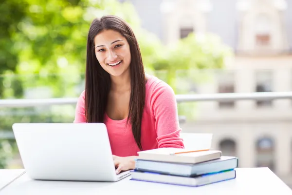 Hispanic college student with laptop