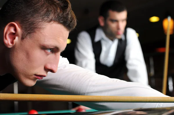 Young professional play snooker