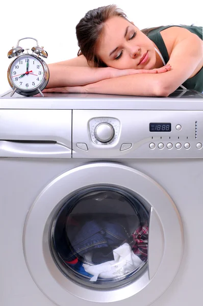 Woman sleeping on a washing machine