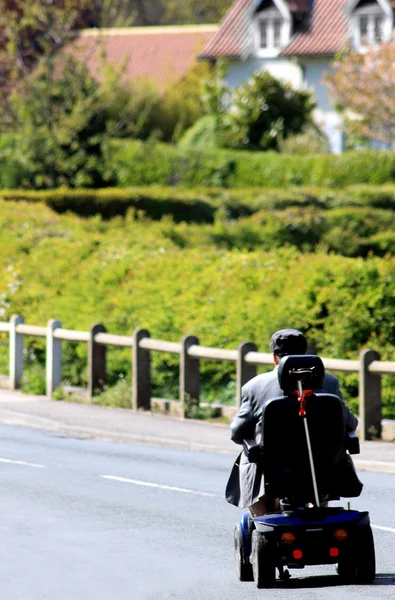 Mobilty scooter and senior man