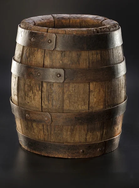 Old barrel on black background