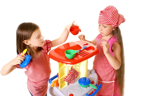 Happy little girls play cooking