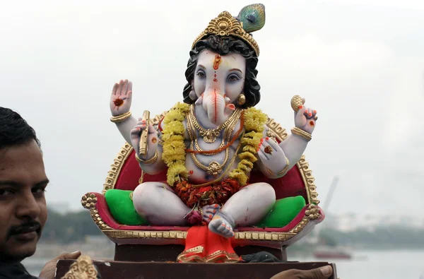 Hindu devotess ready to immerse Lord Ganesha idols during hindu festival
