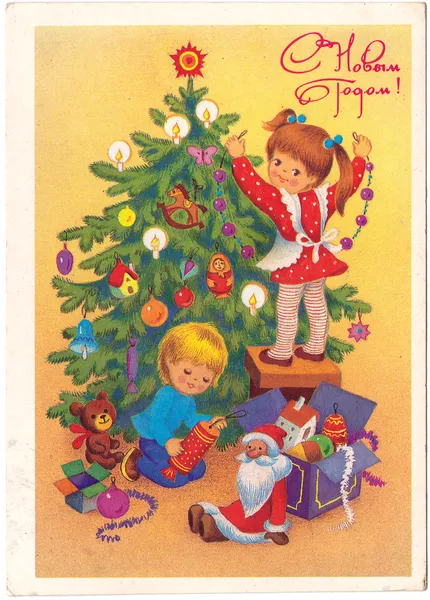 Children decorate a Christmas tree