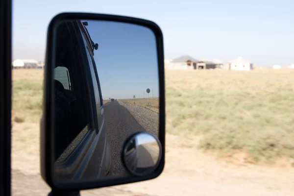 Reflection in the mirror of the road car