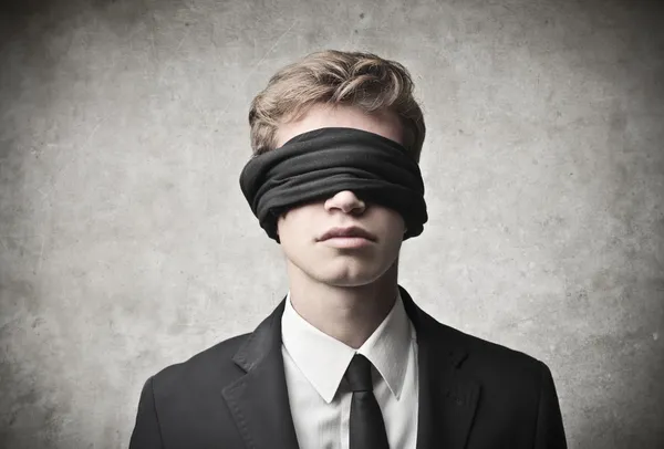 Businessman blindfolded