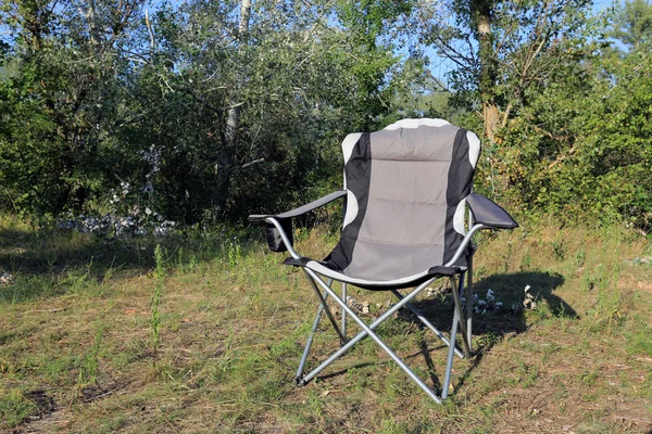 Folding chair on meadow