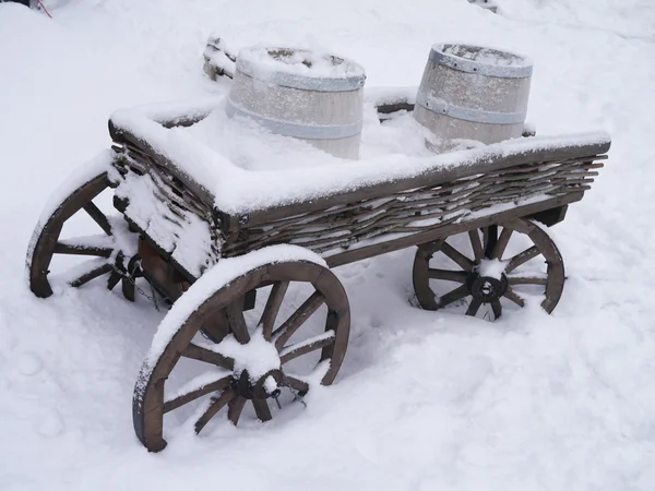 Dray horse with barrels in the snow