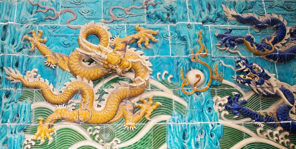 Dragon sculpture. The Nine-Dragon Wall (Jiulongbi) at Beihai park, Beijing, China. The wall was built in 1756 CE