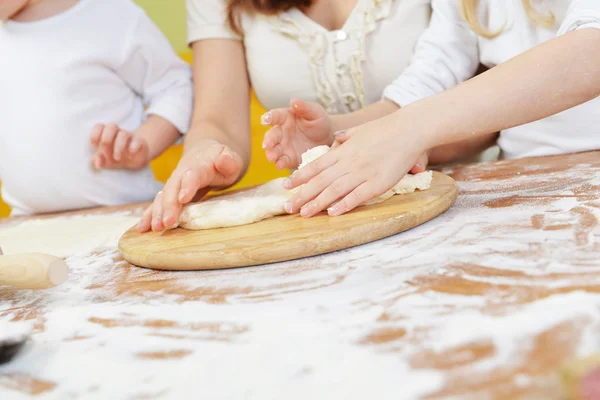 Family preparing dough