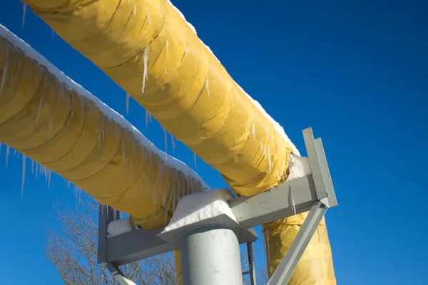 Industrial pipes white cold and hot water with yellow thermal insulation