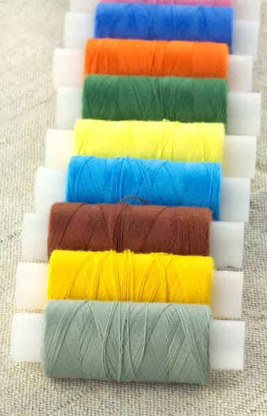 Spools with color threads close up