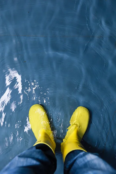 Rubber boots in the water