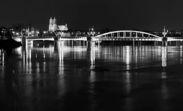 River and bridge by night
