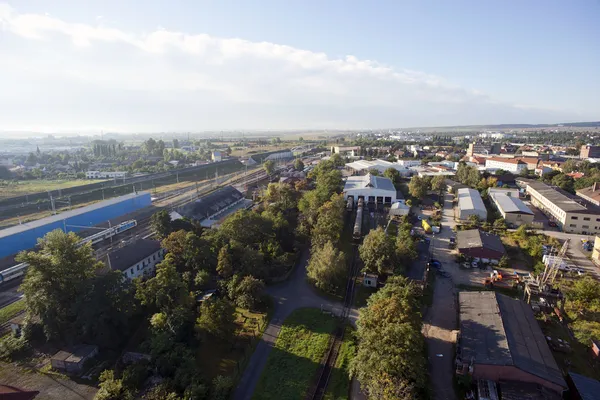 Highly detailed aerial city view with railroads, roads, factorie