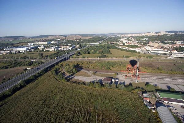 Highly detailed aerial city view with railroads, roads, factorie