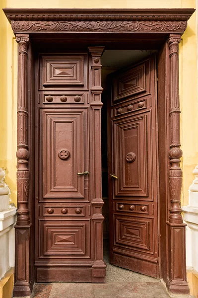 Ancient half-opened wooden door