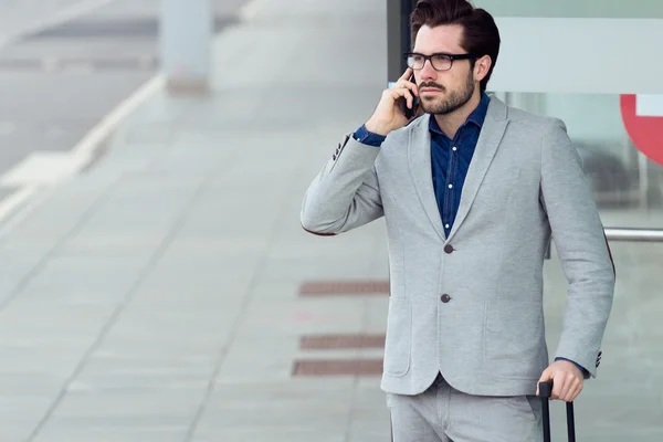 Urban business man talking on smartphone