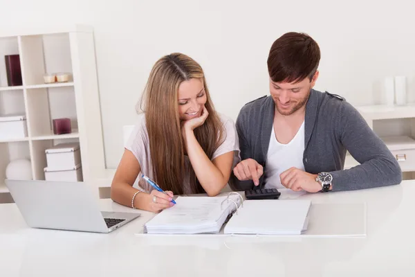 Couple working on expenses