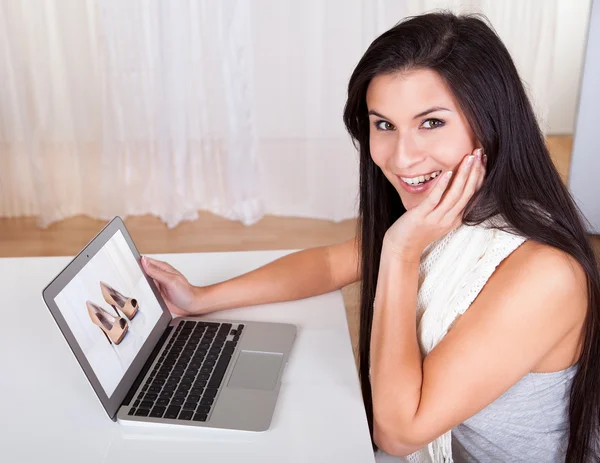 Happy woman shopping online