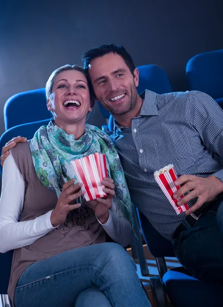 Stylish couple enjoying a movie