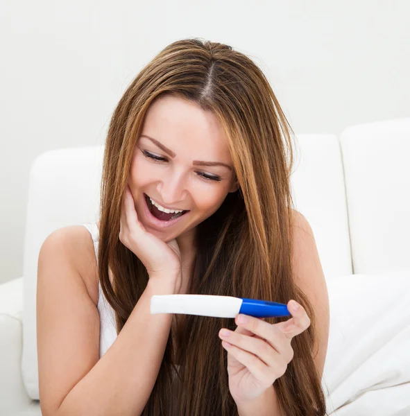 Woman Checking Pregnancy Test