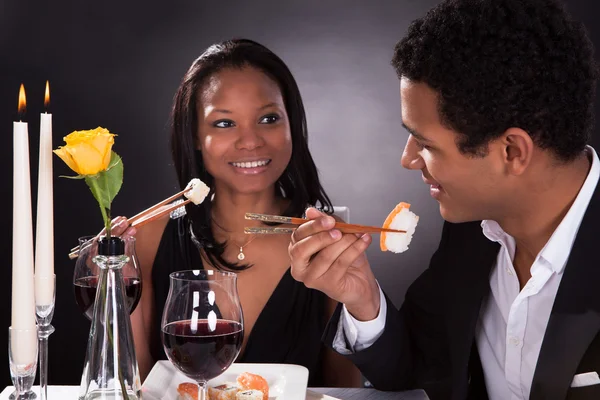 Romantic Couple Eating Sushi