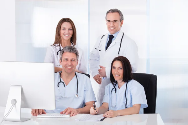 Group Of Doctors Working Together