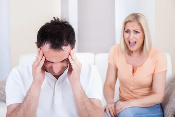 Angry woman shouting at man