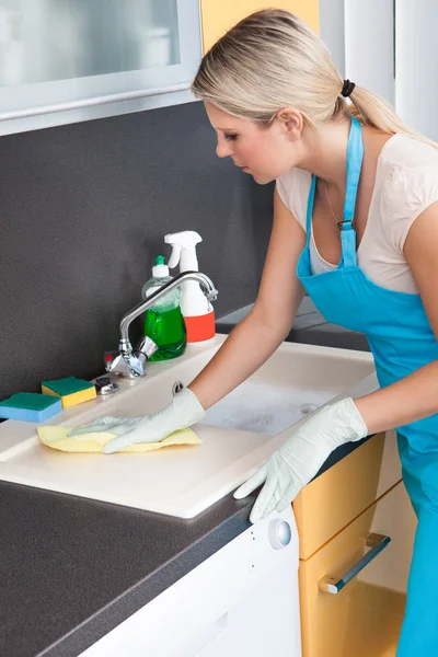 Woman Cleaning Worktop