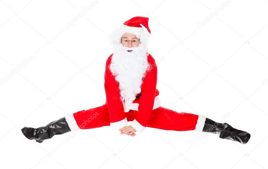 Santa Claus Sits On A Splits — Stock Photo © AndreyPopov 33101985