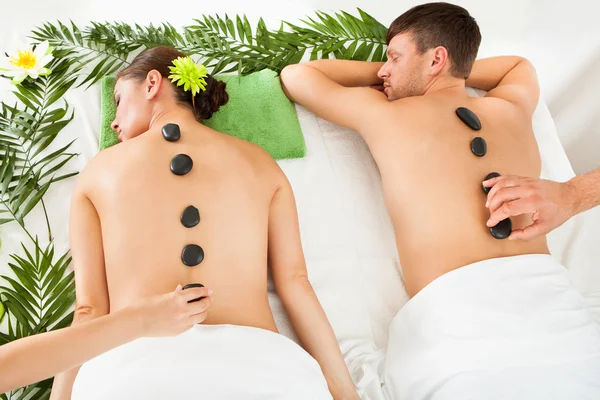 Couple Having A Hot Stone Massage