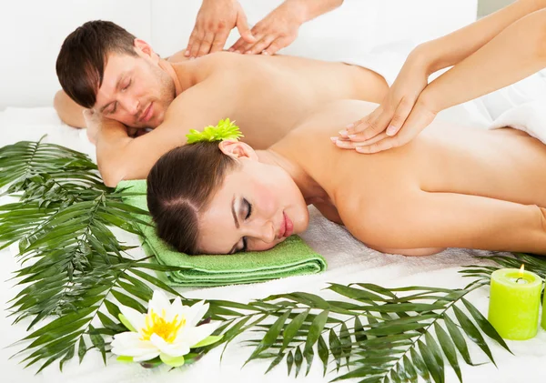 Happy Couple Getting Spa Treatment