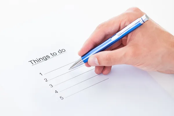 Hand filling things to do list