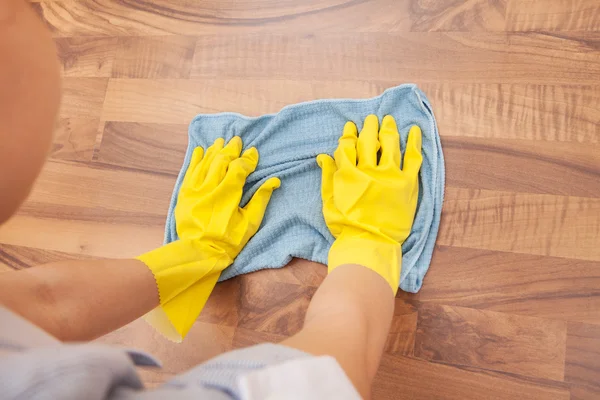 Young Maid Cleaning Floor