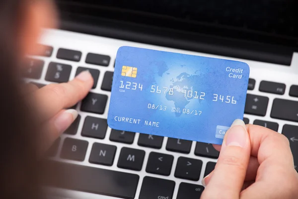 Person Holding Credit Card Using Laptop — Stock Photo #37034235
