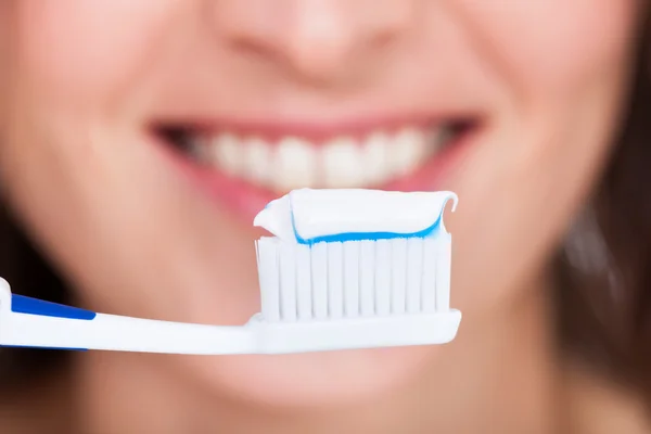 Woman Brushing Teeth