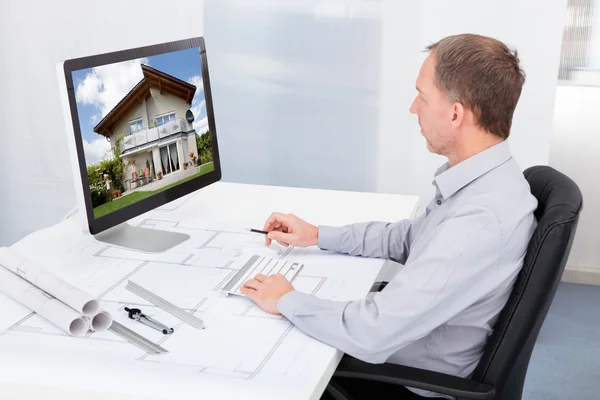 Architect Working On Computer