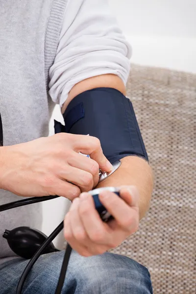 Man Checking Blood Pressure