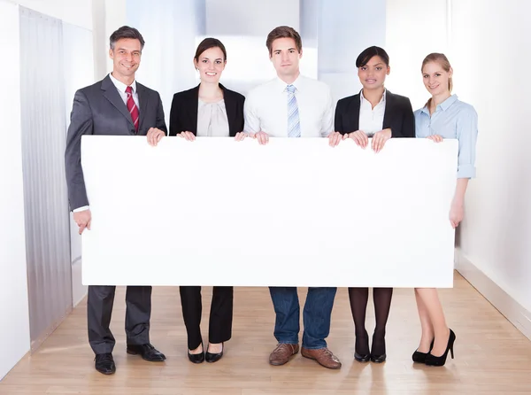 Businesspeople Holding Blank Placard