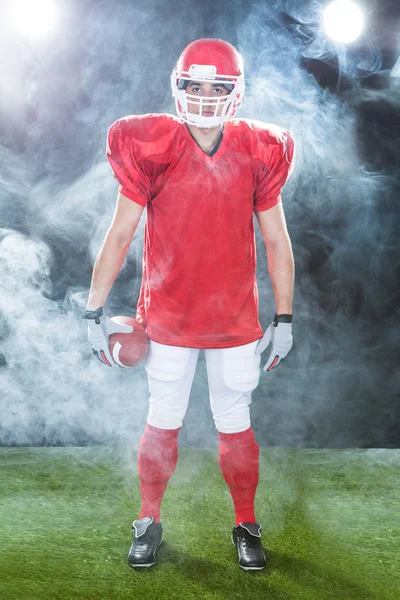 Portrait Of Confident American Football Player On Field