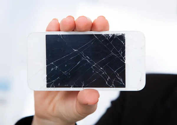 Person Holding Damaged Cellphone