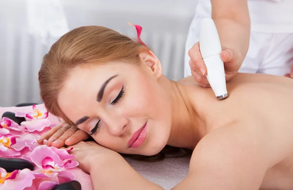 Woman Under Going Microdermabrasion Treatment