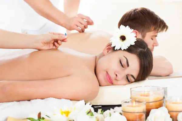 Happy Woman Undergoing Acupuncture